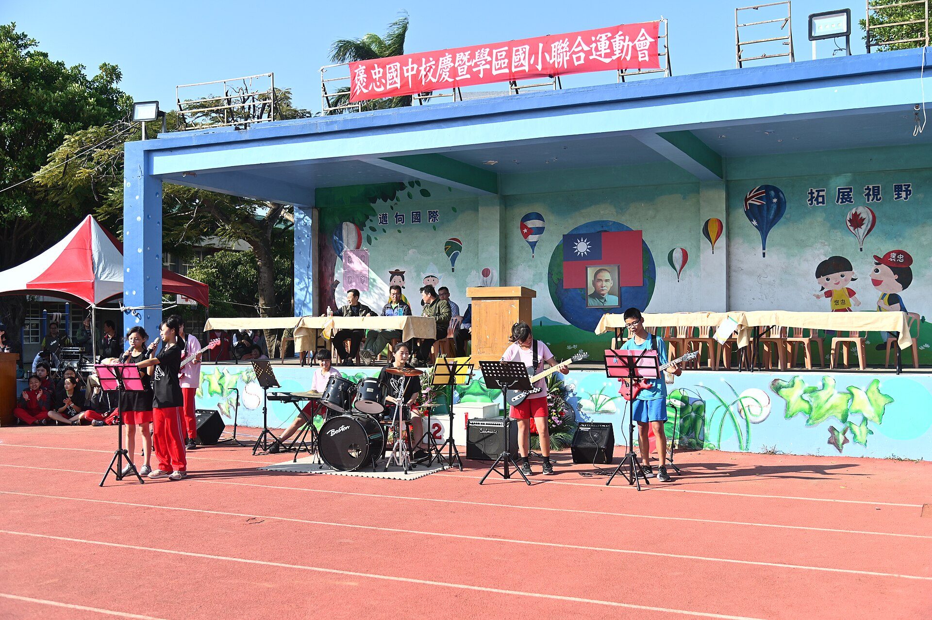 Students performing on stage in the school auditorium