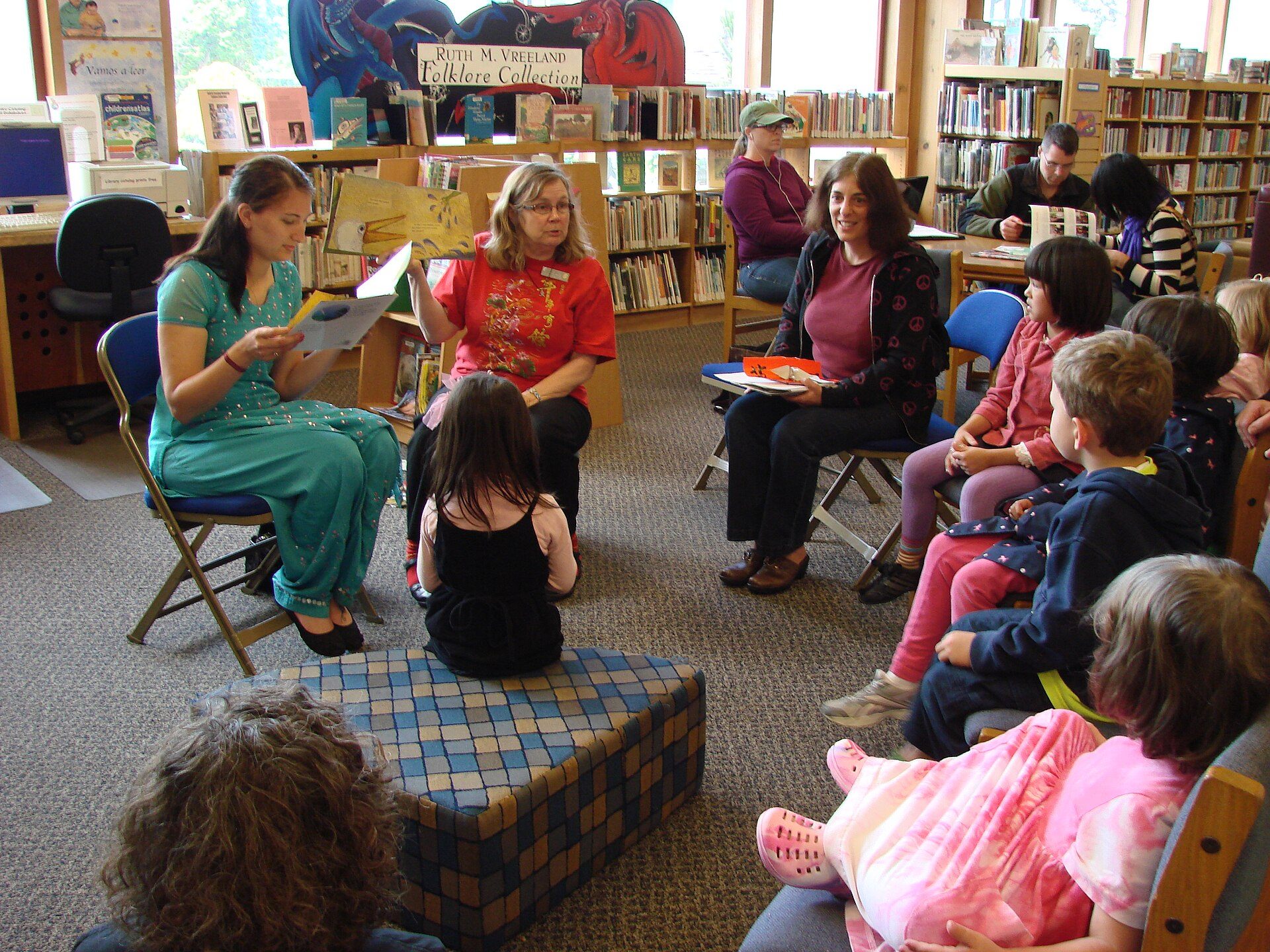 Children gathered for story hour in the reading pit
